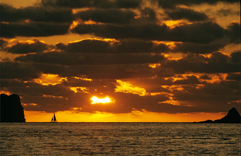 A Lone Sailboat on the Horizon as the Sun Sets Ixtapa Mexico Fine Art Photo