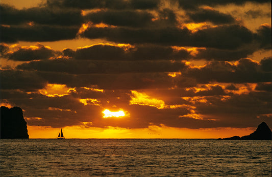A Lone Sailboat on the Horizon as the Sun Sets Ixtapa Mexico Fine Art Photo