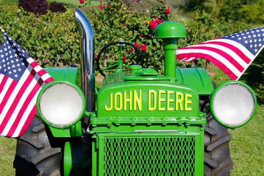 Antique John Deere Tractor with American Flags by John Harmon